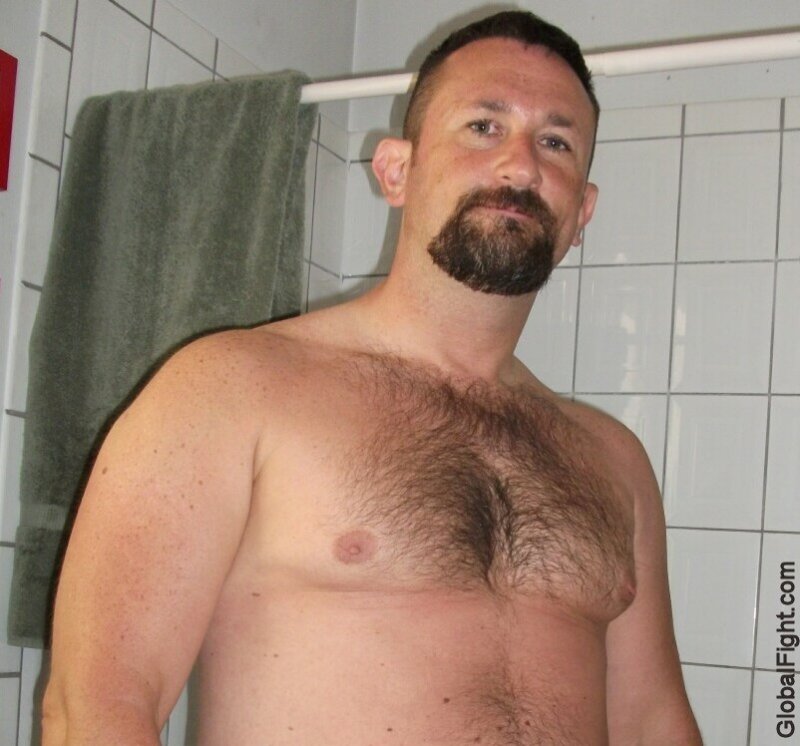 a bearded gay man in restroom tight hairypecs.jpg