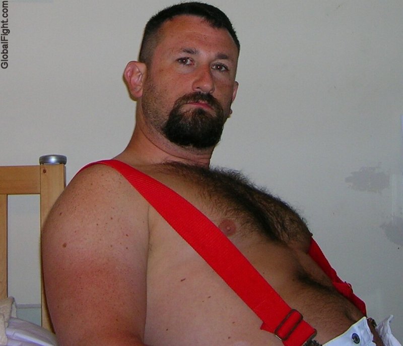 a hairy manly bear wearing red suspenders.jpg