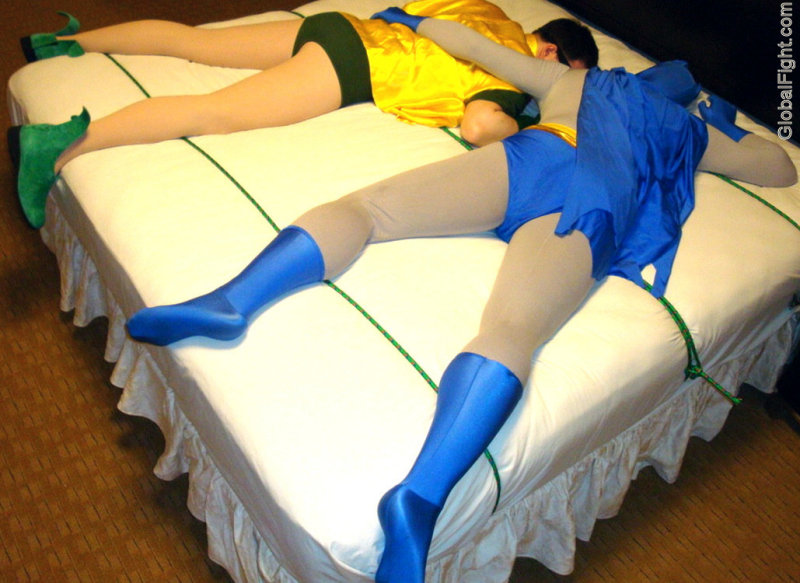 a gay super heros asleeping together in bed.jpg