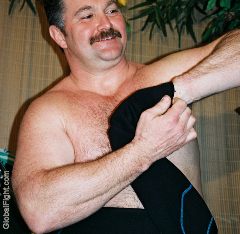 a big arms musclebear daddy undressing.jpg