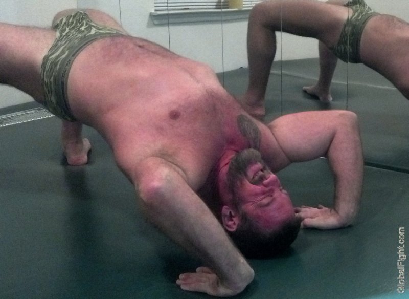 bigbear doing stretching exercises gay club gym.jpg