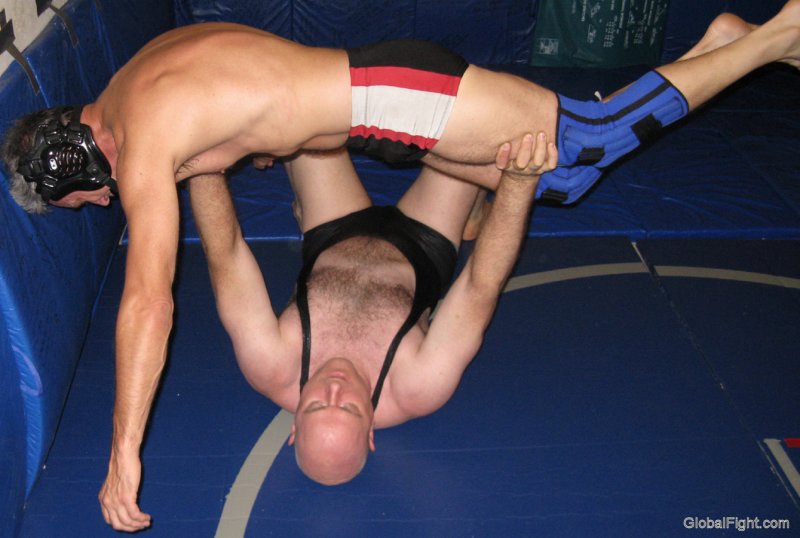 man lifting silverdaddie over head powerfull guys wrestling.jpg