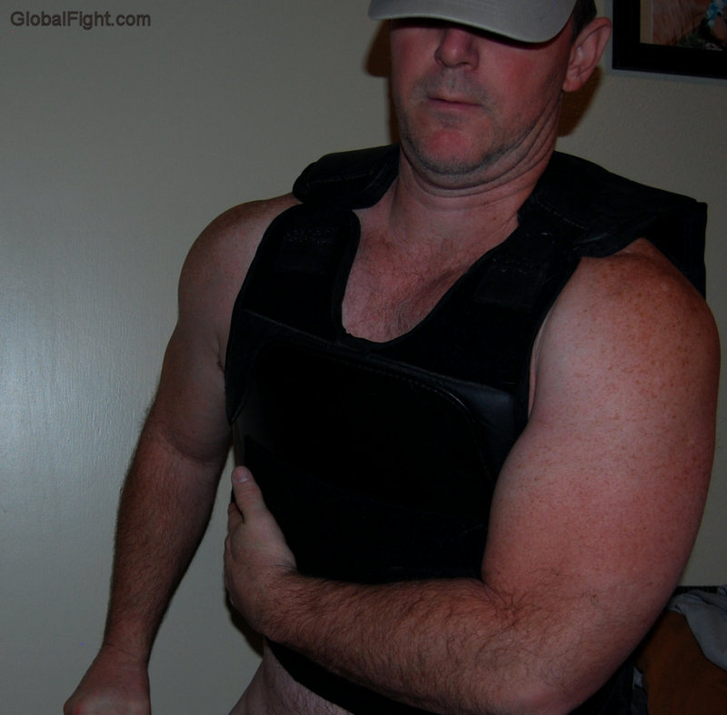 policeman removing bullet proof vest men cops undressing shirtless.jpg