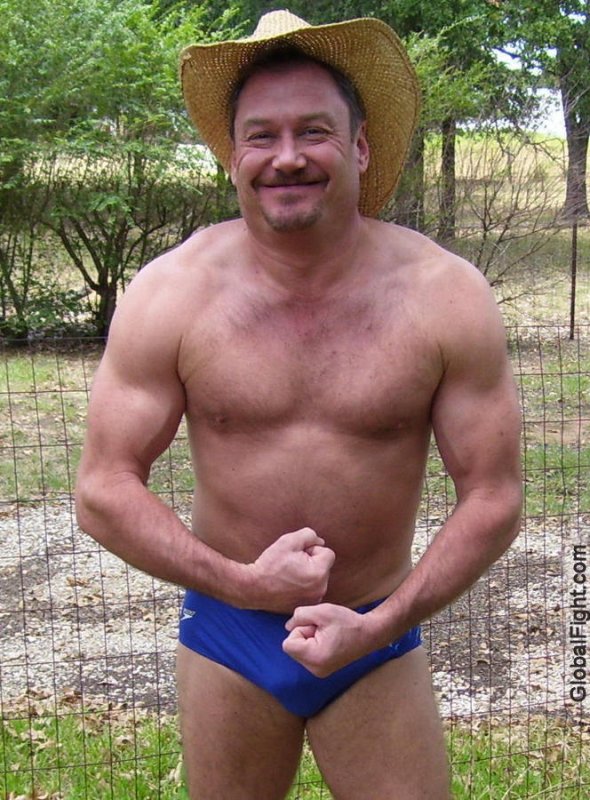 muscular redneck guy flexing arms muscles hairychest.jpg