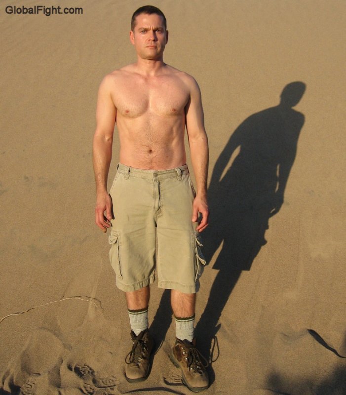 gay man standing desert beach sandpit sweaty hiking pics.jpg