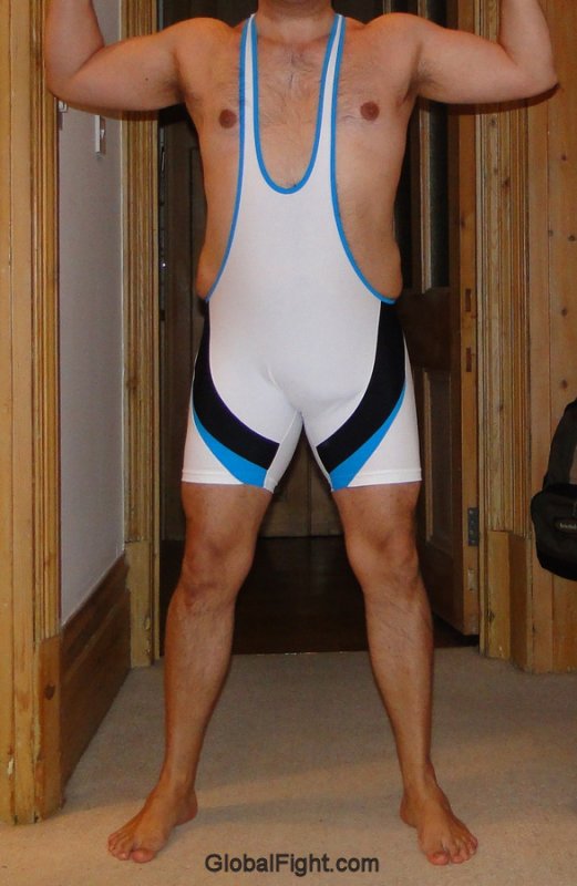 hispanic male man flexing arms wearing spandex singlets.jpg