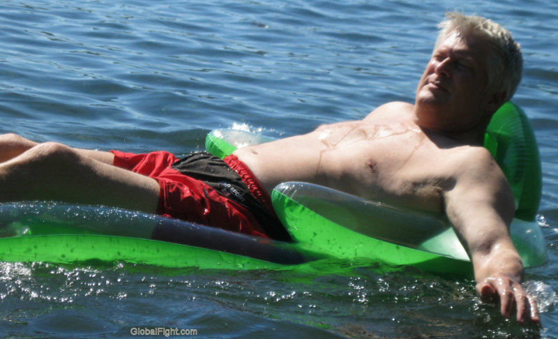dad lounging raft ocean lake swimming dripping wet blond daddie.jpg