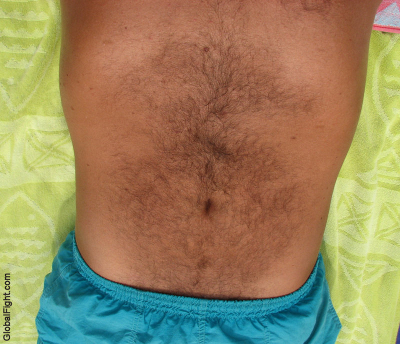 my brothers hairy belly navel swimming trunks suntanning tanned.jpg