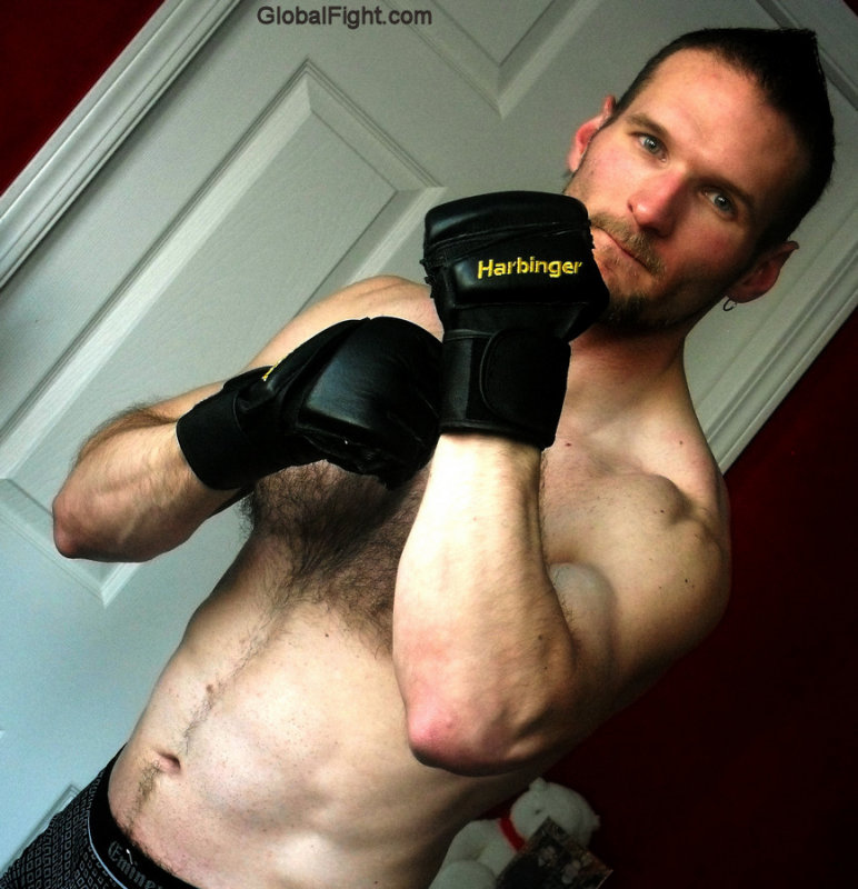 arms up fighter wearing sparring gloves fighting pose down.jpg