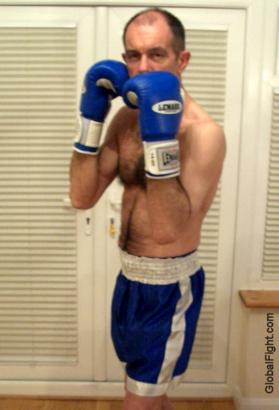 older boxer daddy wearing gloves satin trunks pictures.jpg