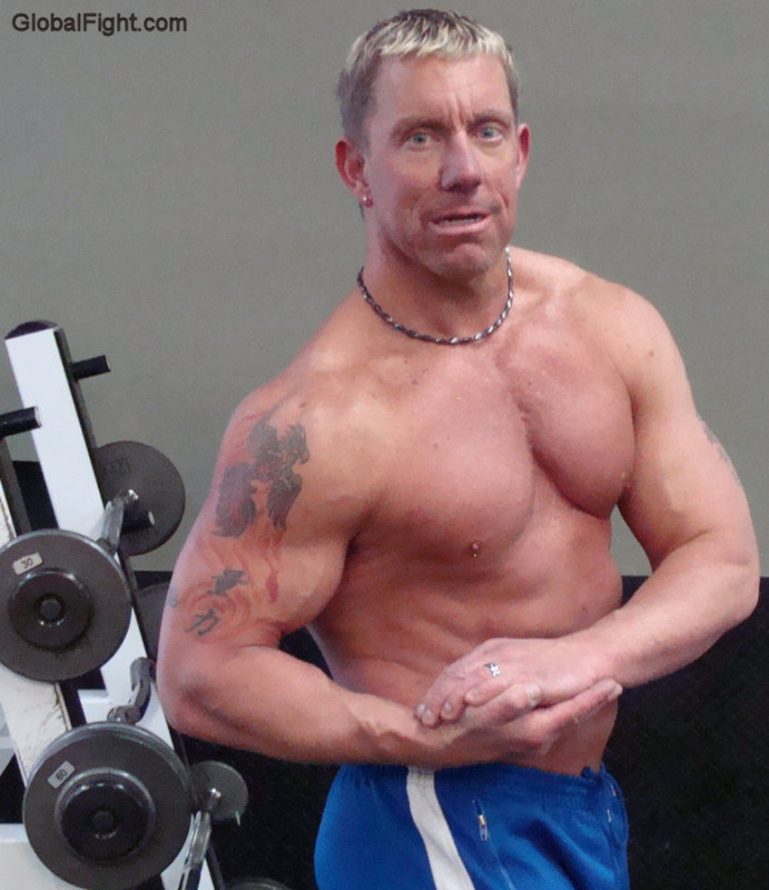 blond muscleman flexing arms tattoos pictures gym.jpg