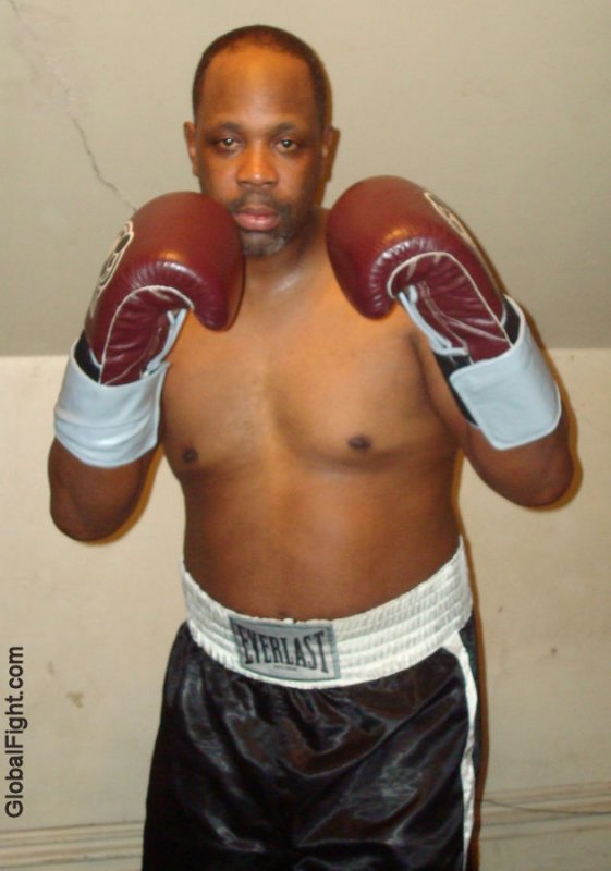 muscular black boxer wearing everlast satin trunks.jpg