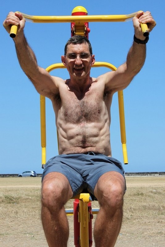 hairy daddy beach workout weight lifting older men.jpg