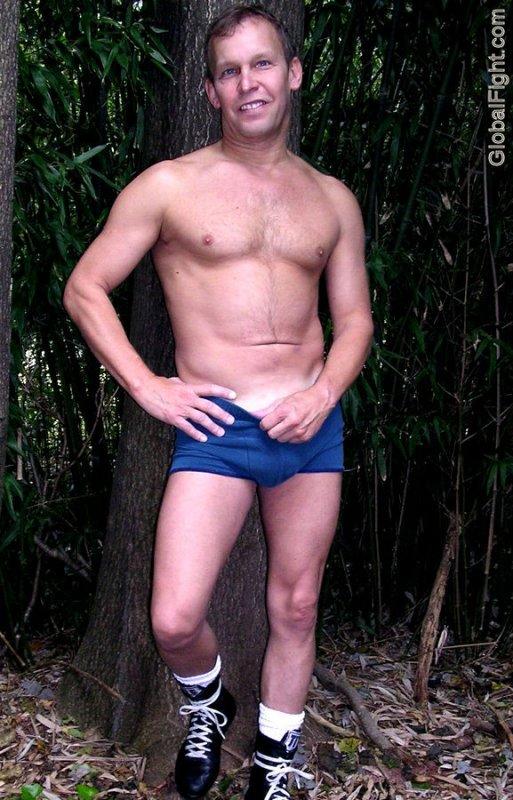 muscular handsome jock pulling down pants shorts.jpg
