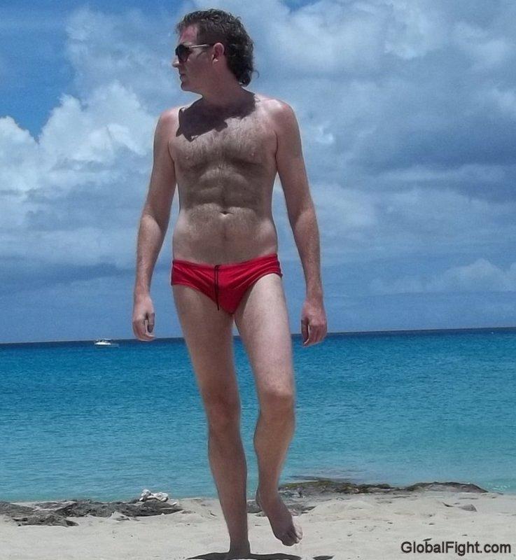 man wearing skimpy bathing suit foreign beach.jpg
