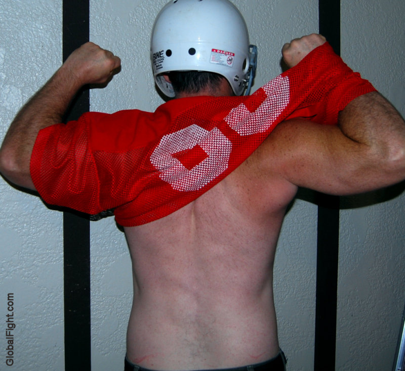 football player removing jersey undressing.jpg