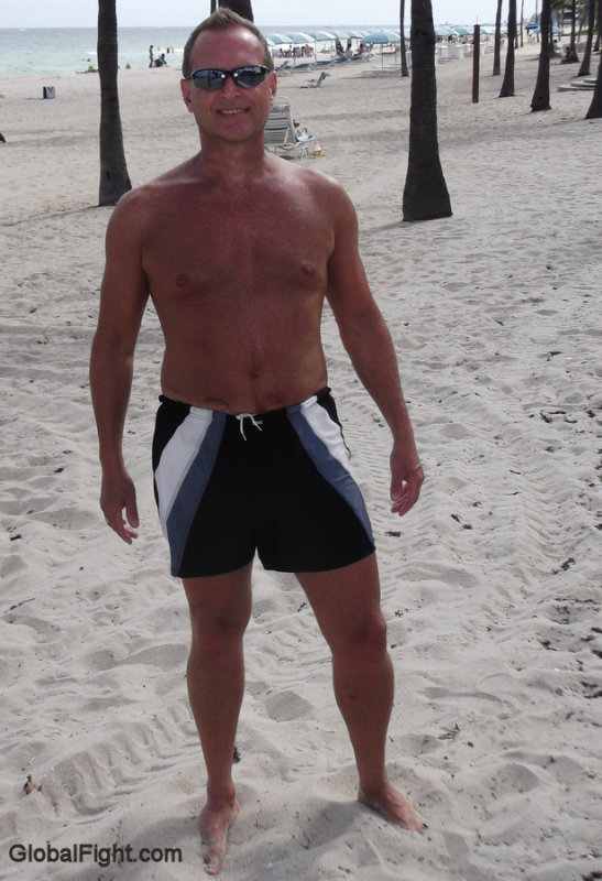 dad getting suntanned sandy beach.jpg