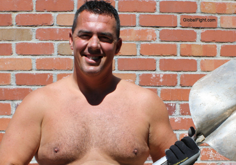 dad shoverling dirt backyard working.JPG