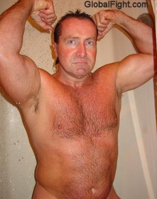 older man flexing shower.jpg