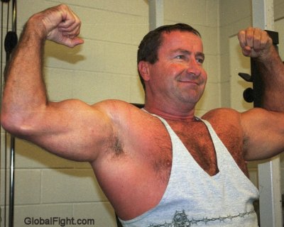 hairy musclebear daddy flexing.jpg