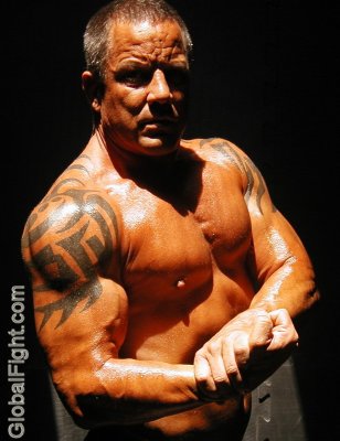 tattoos muscleman flexing chest.jpg