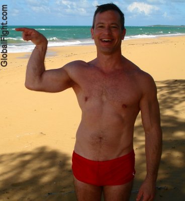 beach guy flexing muscles.jpg