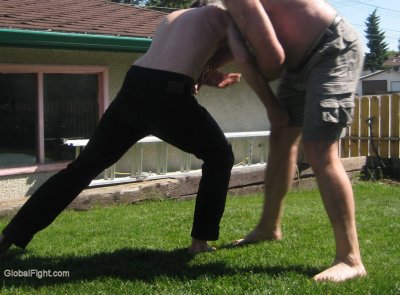 wrestling daddy son backyard.jpeg