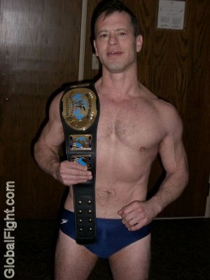 pro wrestler belt posing.jpg