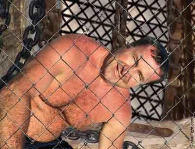 caged manly men jailed cell beaten whipped flogged.jpg