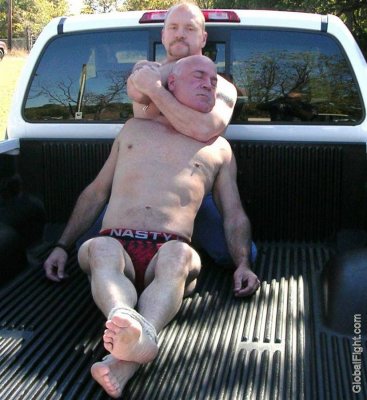 rednecks wrestling truck bed fighting older men.jpg