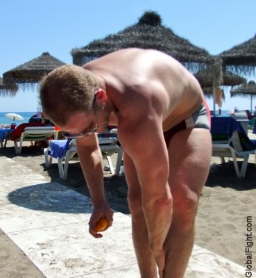beach man tanning lotion.jpeg