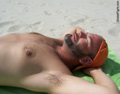 hairy daddy man suntanning on beach guys.jpg