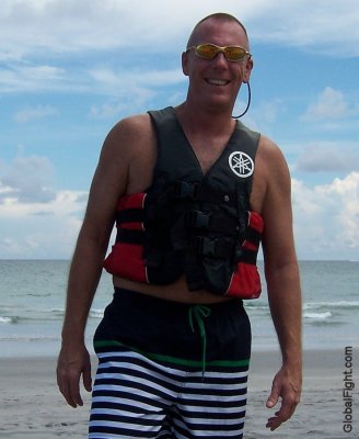 man wearing boating life jacket wearing vest swimming.jpg