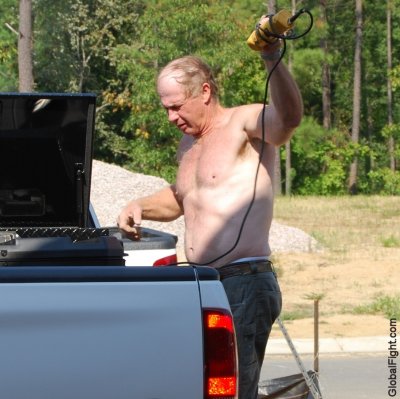 candid working man captured shirtless.jpg