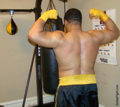 huge thick black brawler muscles boxer stocky man.jpg