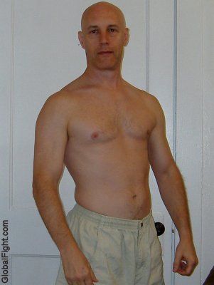bald hot gay personal trainer weight lifting.jpg