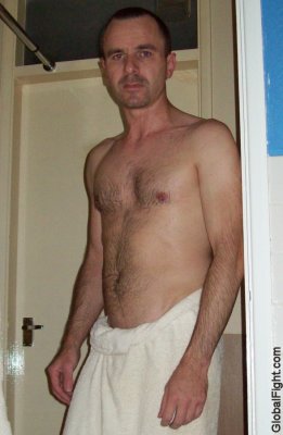 man showering towel locker room drying off gym.jpg