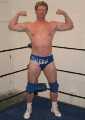 tall handsome daddy wrestler flexing big biceps.jpg