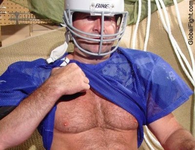 football jock man removing jersey shirt.jpg
