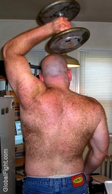 hairyback bald man lifting weights.jpeg