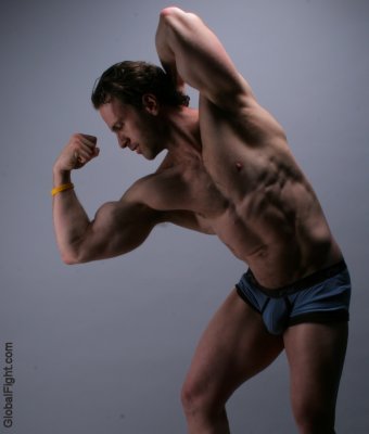 huge muscular professional bodybuilder flexing biceps.jpg