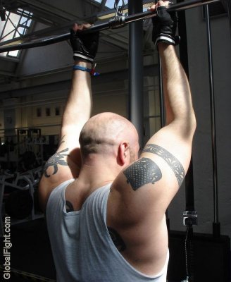 huge powerlifter tattooed man gym lifting.jpeg