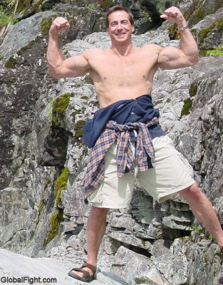 man hiking dad shirtless flexing big biceps.jpg
