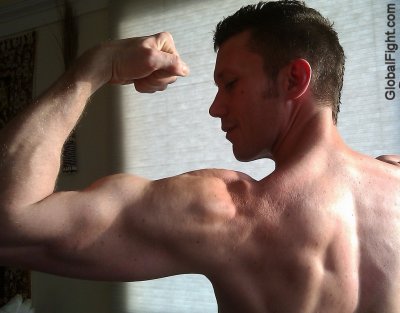 biceps flexing rear view.jpg
