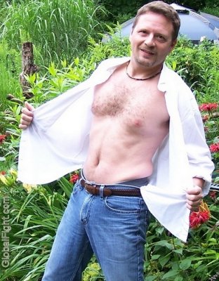 camping hiking man opening shirt removing clothes.jpg