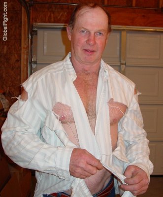 redhead man removing torn shirt.jpg