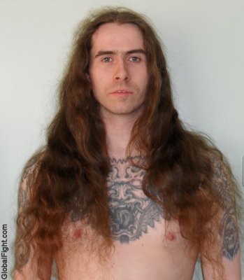 long haired wrestler man wrestling tattooed chest.jpg