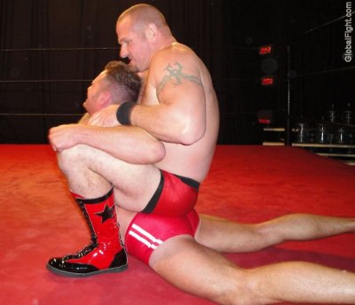 pro wrestling leather boots tattooed big arms.jpg