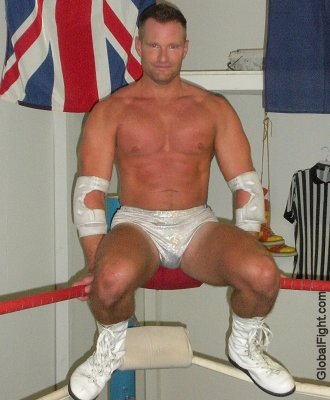 wrestler hunky man sitting on turnbuckles.jpg