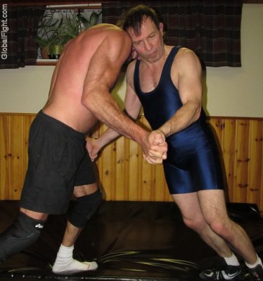 wrestlers locked up locking hands hairy forearms legs.jpg